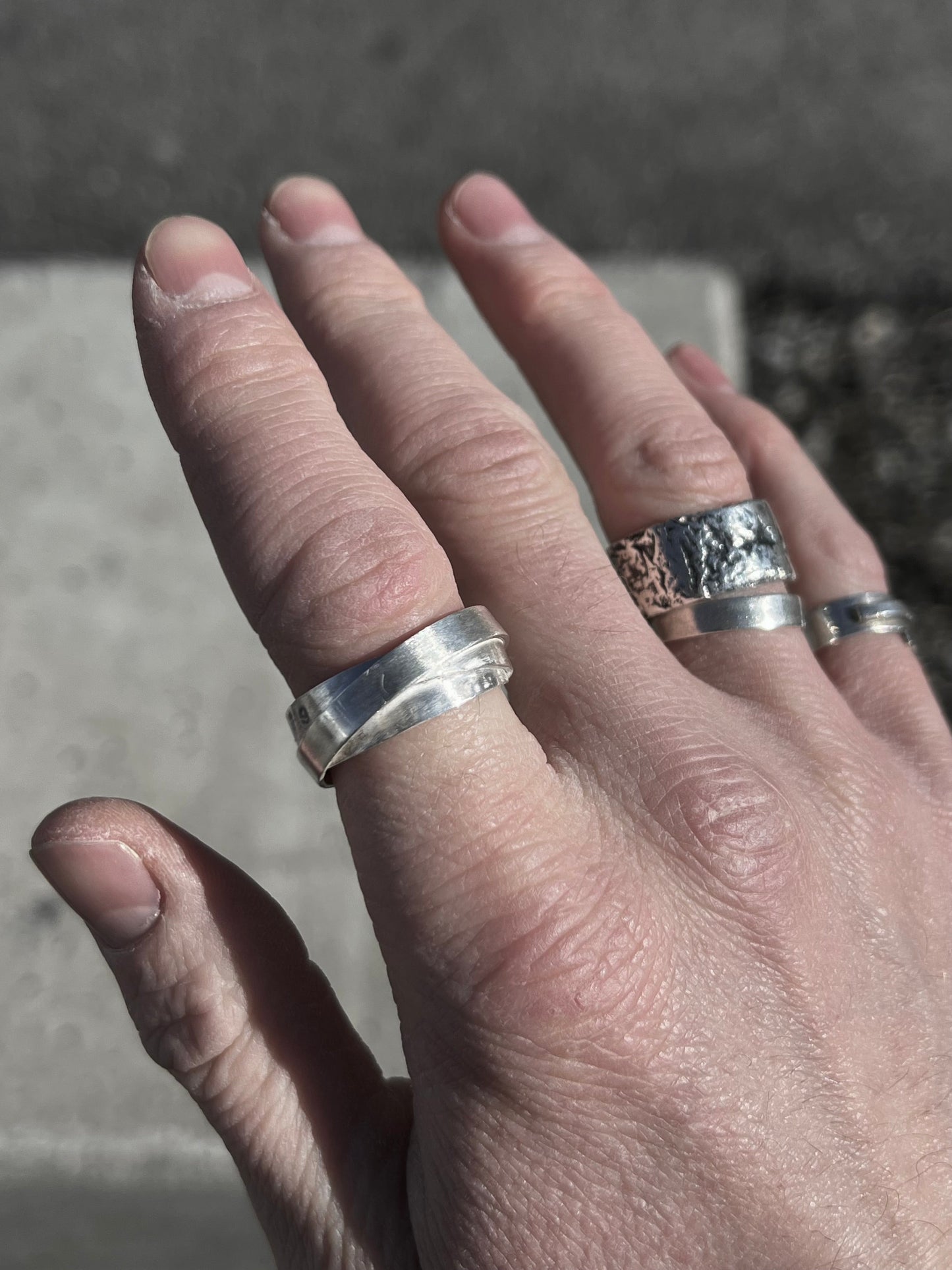 Avant-garde ring made of 925 sterling silver. Unique design, 3 rings forged together to one.