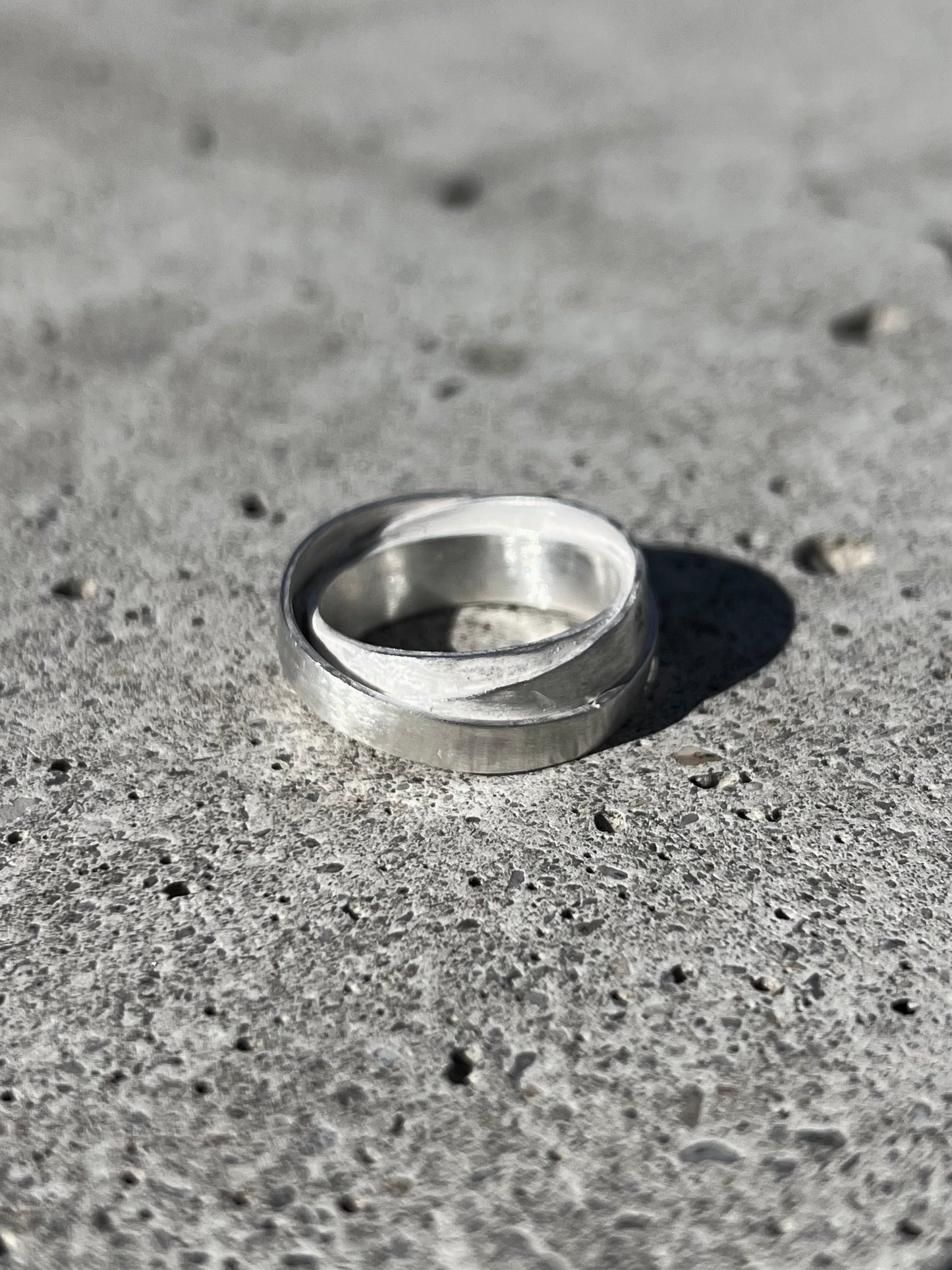 Avant-garde ring made of 925 sterling silver. Unique design, 3 rings forged together to one.