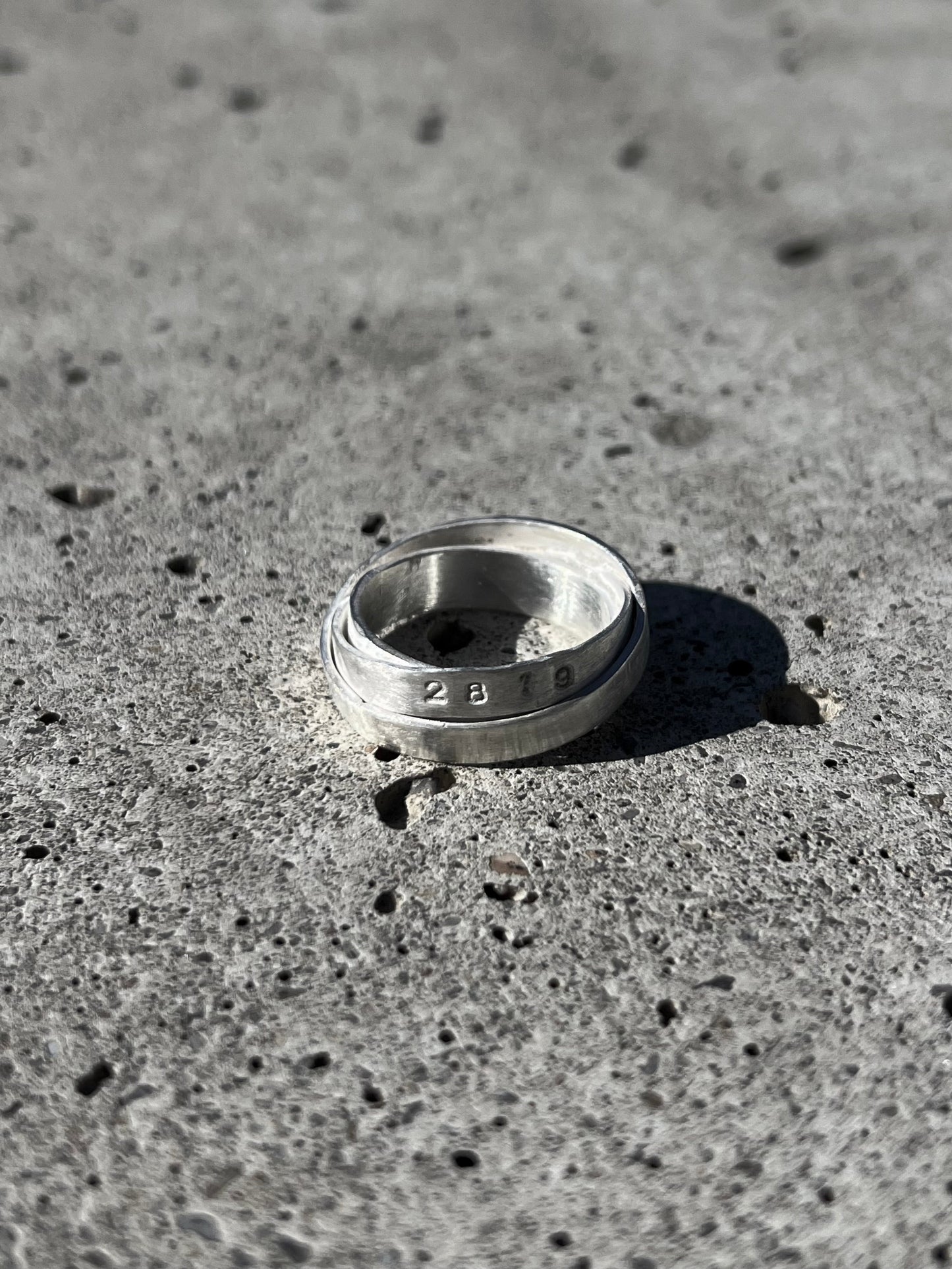 Avant-garde ring made of 925 sterling silver. Unique design, 3 rings forged together to one.