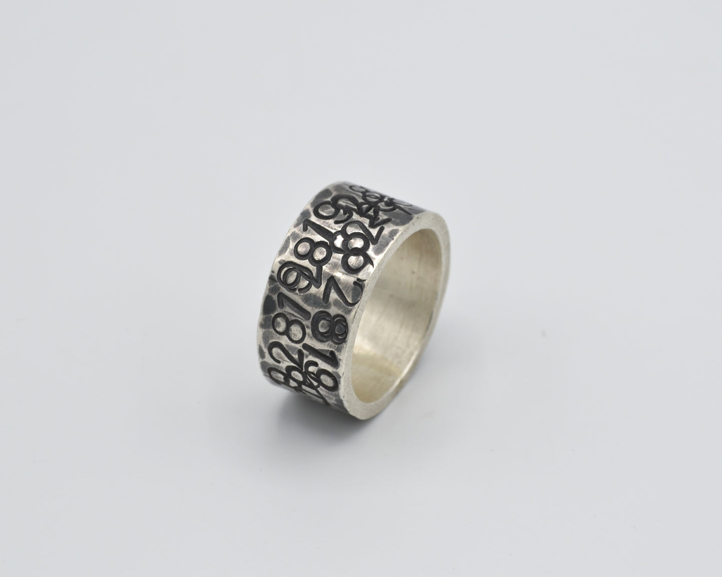 avantgarde, oxidized silver ring with numbers punched in