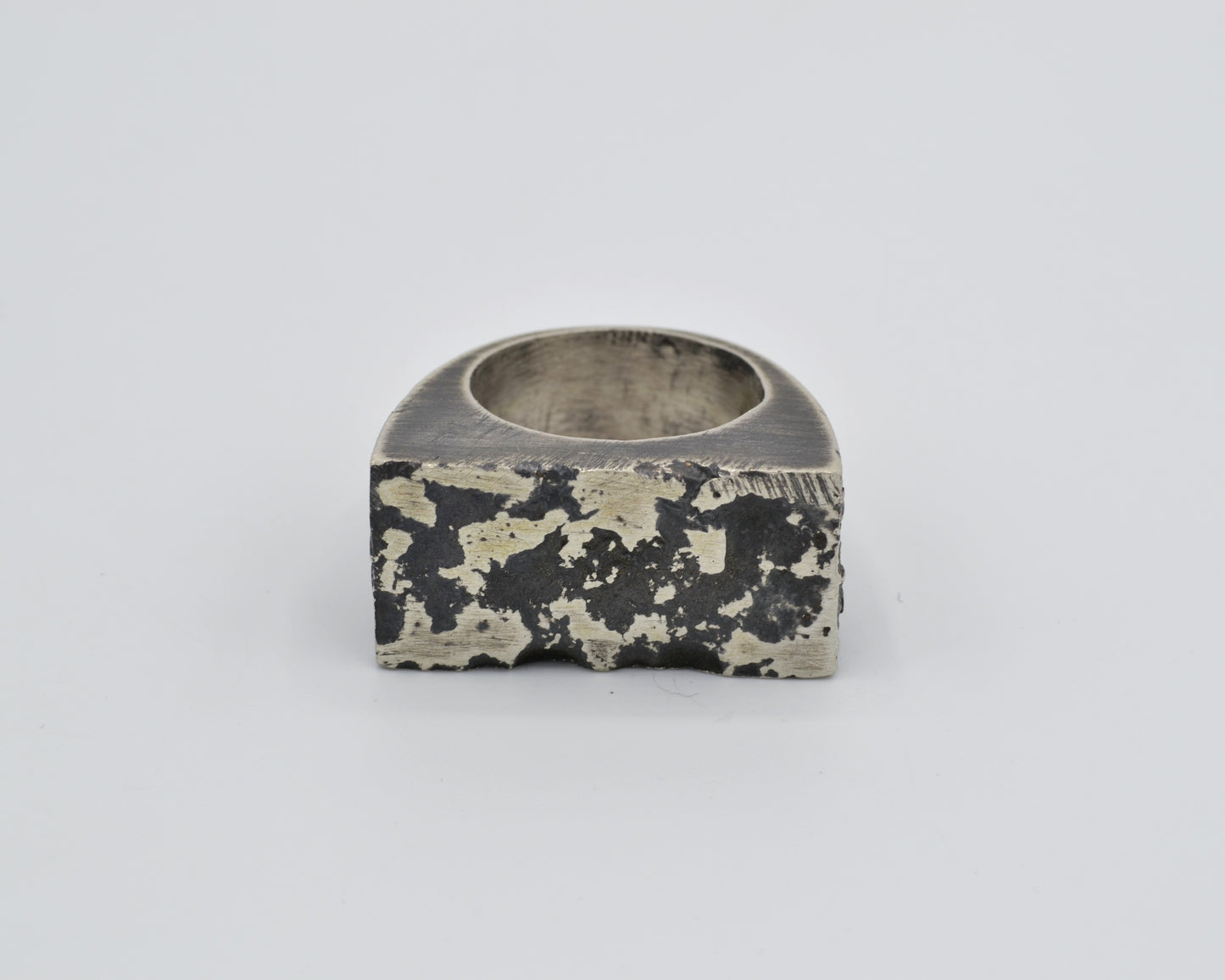 chunky silver ring with oxidized texture, made using sand casting technique
