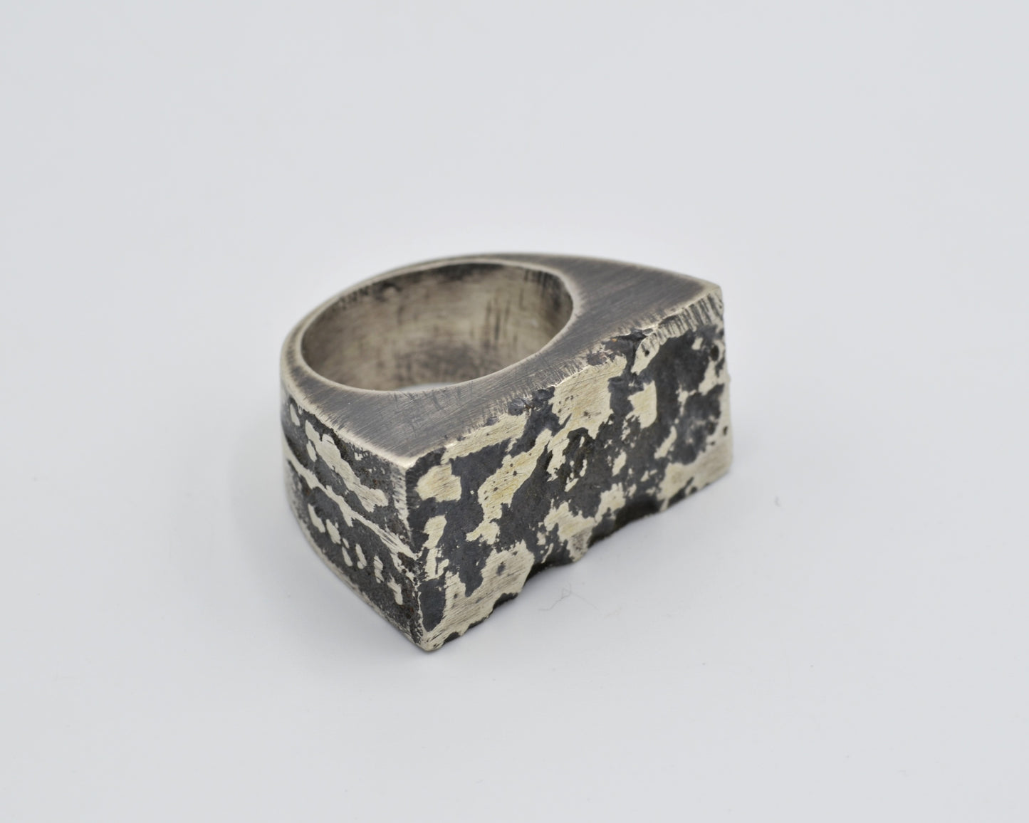 Heavy silver ring with oxidized texture, made using sand casting technique