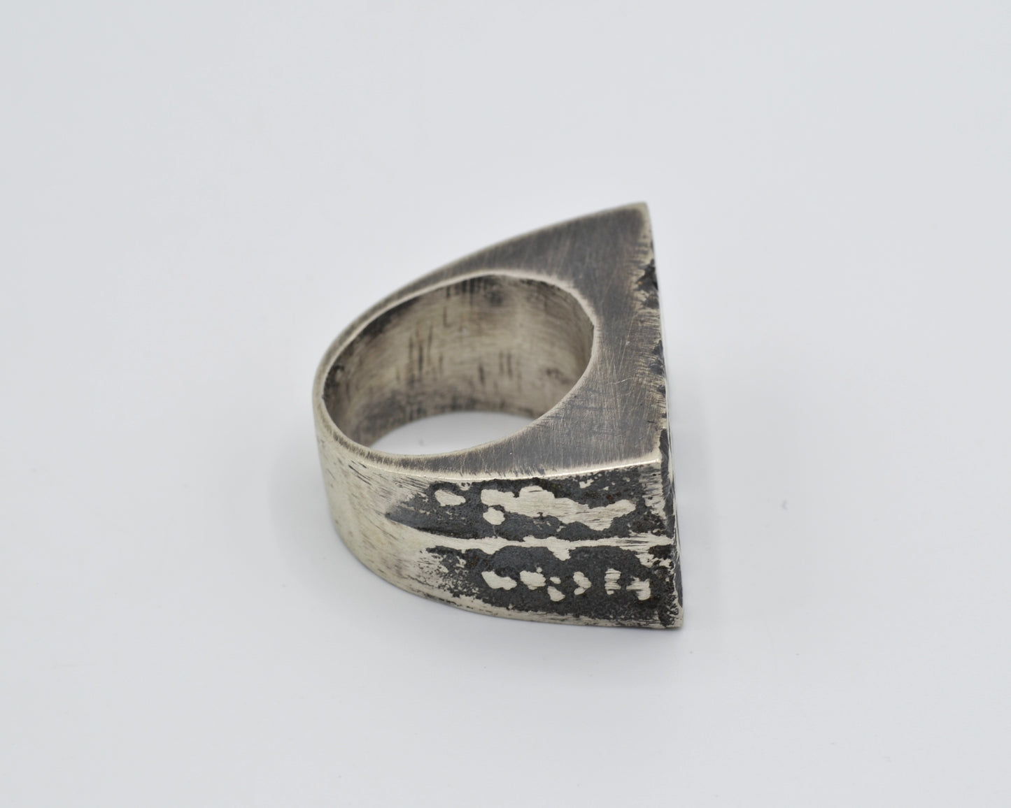 Raw silver ring with oxidized texture, made using sand casting technique