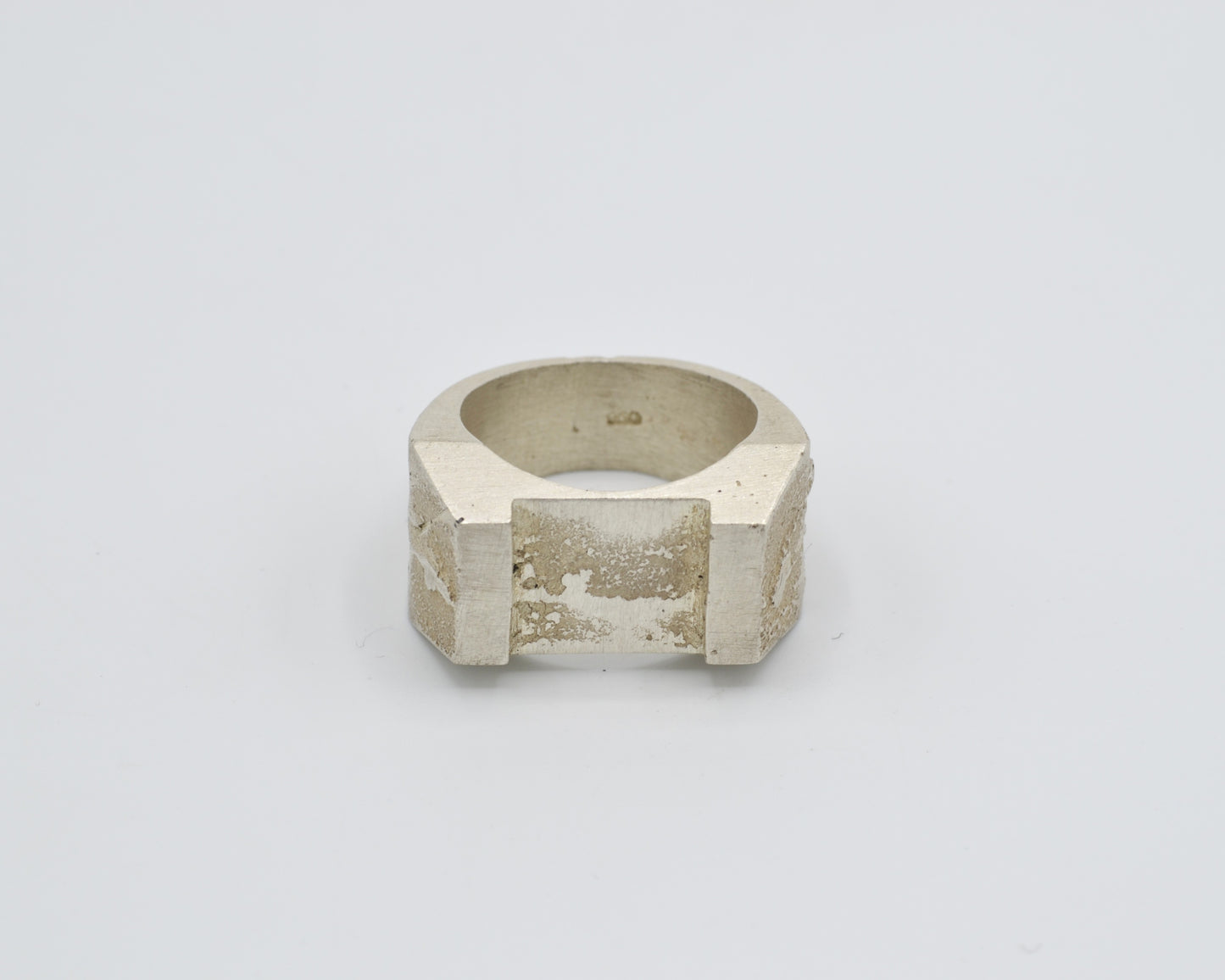 Sand cast ring with sculptural, brutalist design. Raw surface