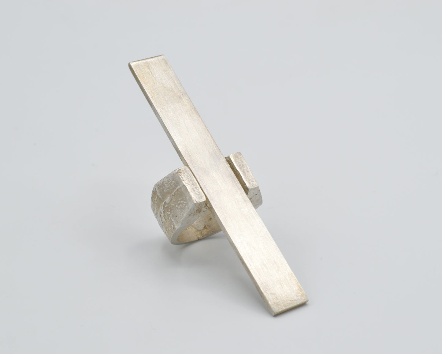 Avant-garde statement ring that reaches vertically over the finger, handcrafted from solid silver