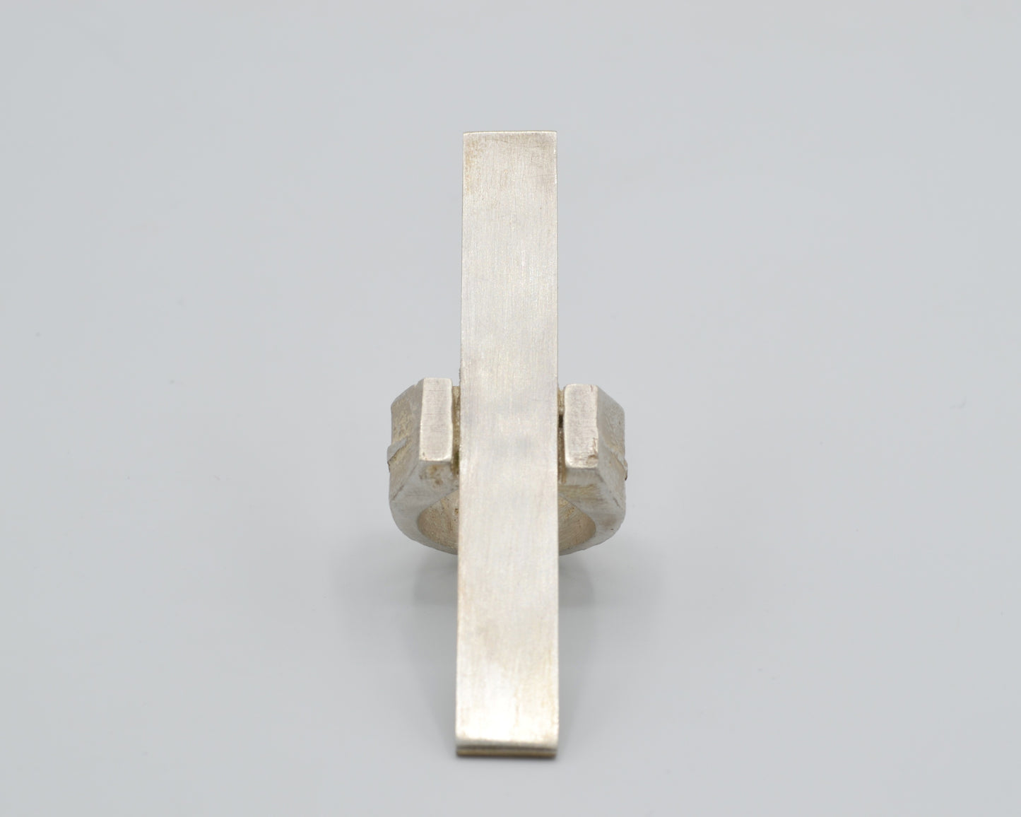 Avant-garde statement ring that reaches vertically over the finger, handcrafted from solid silver
