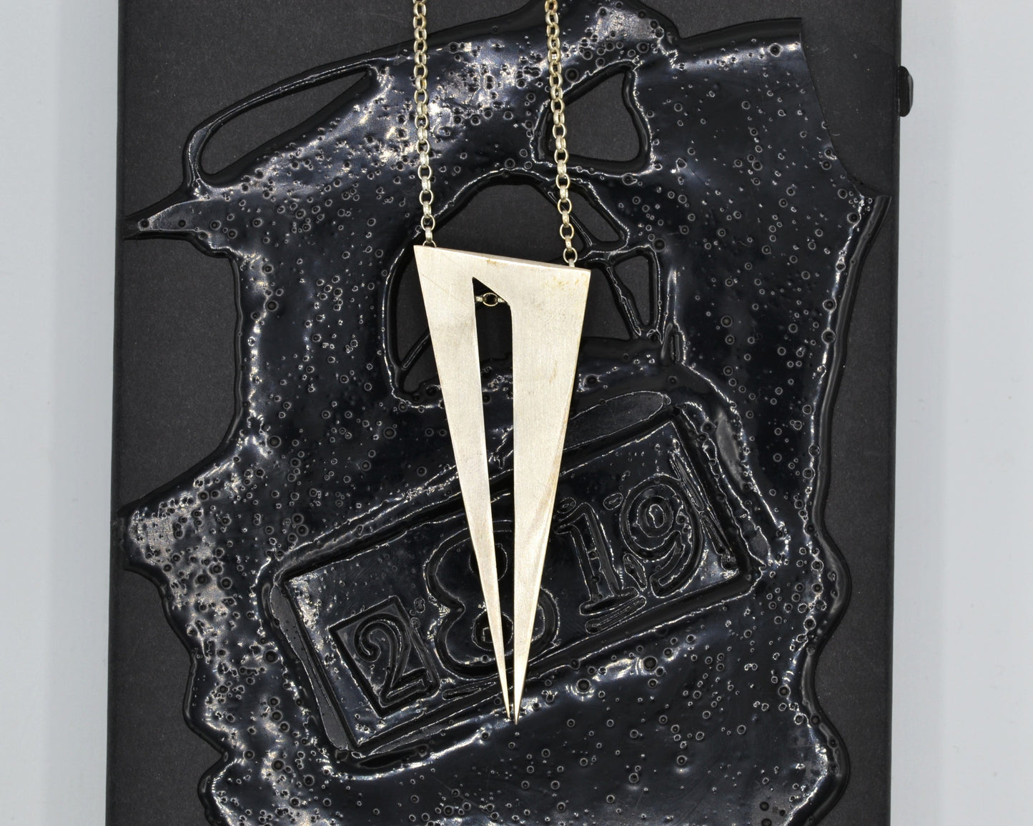 Bold pendant in 950 silver, handmade and architectural in feel with a dark, mysterious aesthetic.