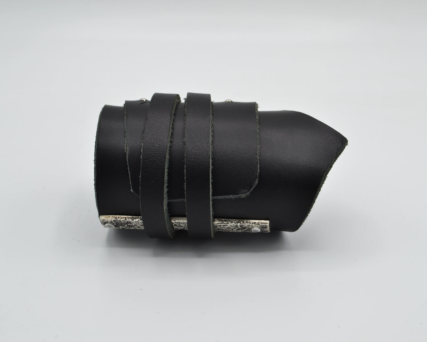 avantgarde, dark aesthetic leather bracelet with signature sterling silver plate mounted at the side.
