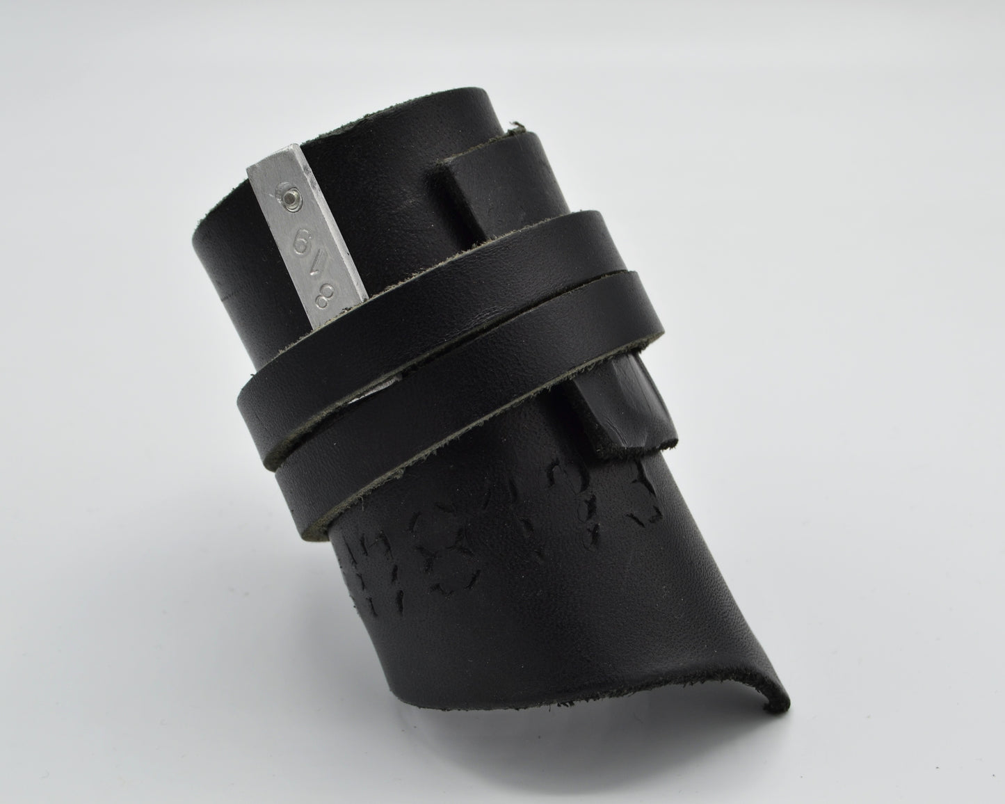 avantgarde, dark aesthetic leather bracelet with small aluminum plate mounted at the side.