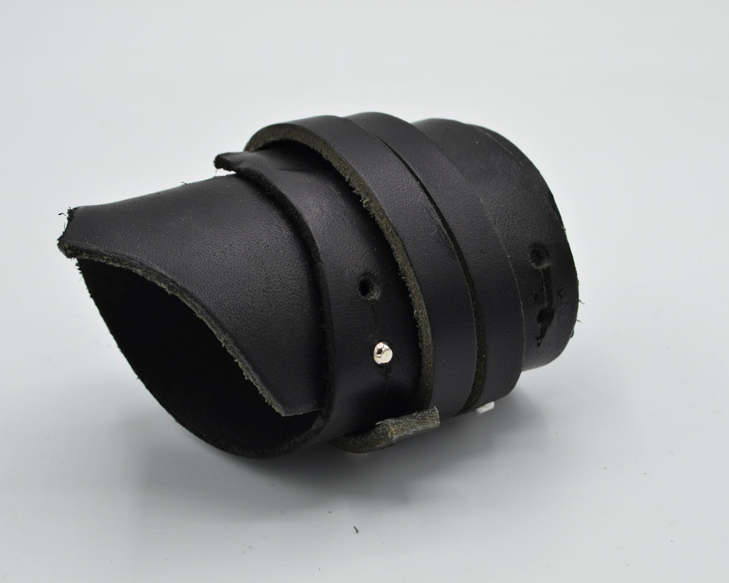 avantgarde, dark aesthetic leather bracelet with small aluminum plate mounted at the side.