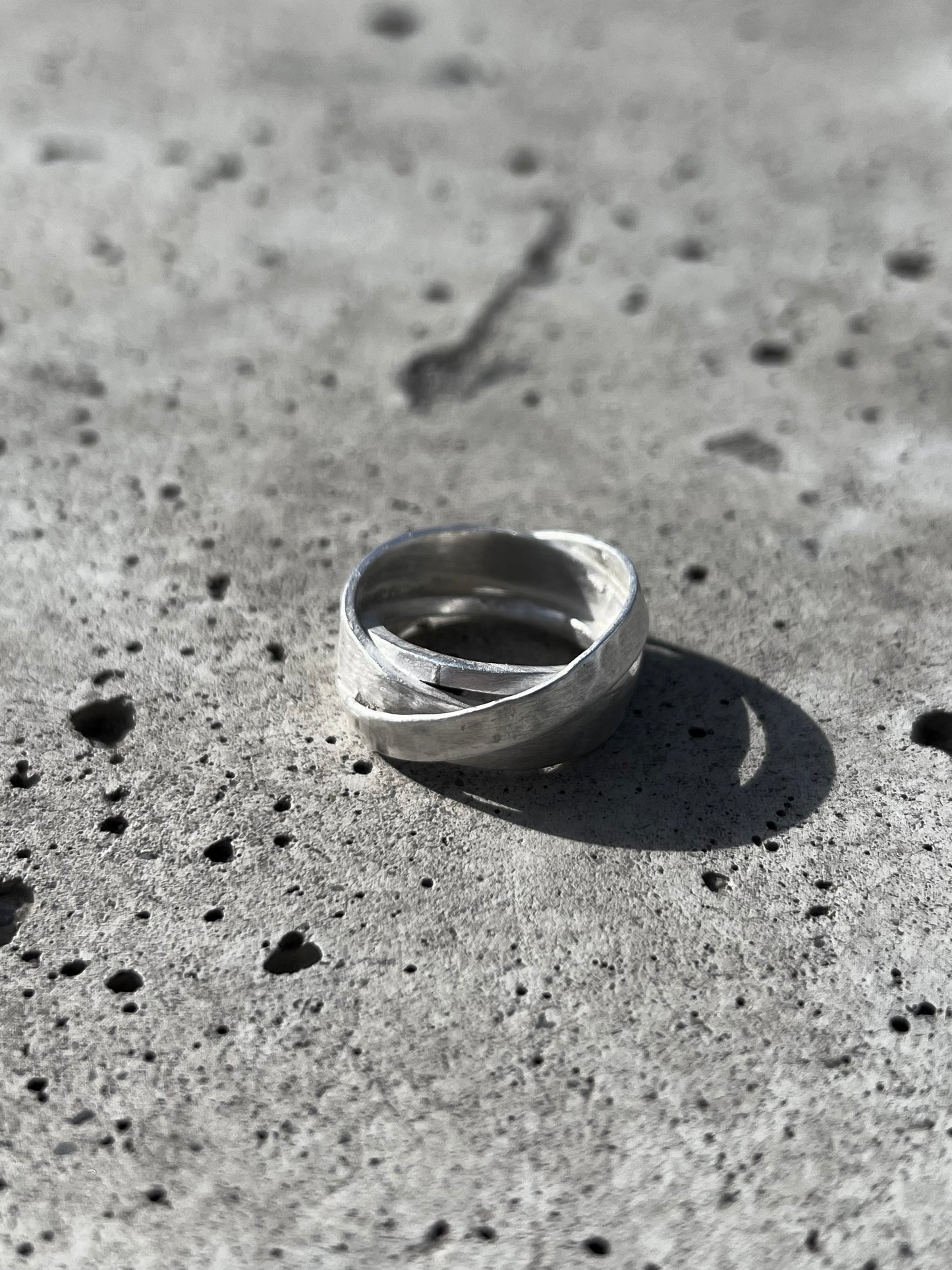 Avant-garde ring made of 925 sterling silver. Unique design, 3 rings forged together to one.