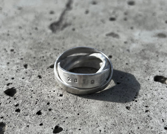 Avant-garde ring made of 925 sterling silver. Unique design, 3 rings forged together to one.