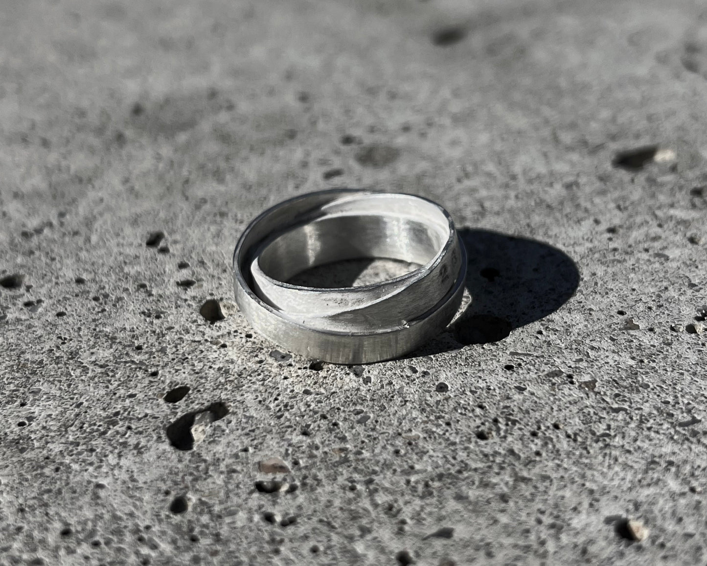Avant-garde ring made of 925 sterling silver. Unique design, 3 rings forged together to one.