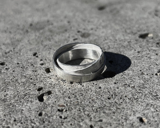 Avant-garde ring made of 925 sterling silver. Unique design, 3 rings forged together to one.