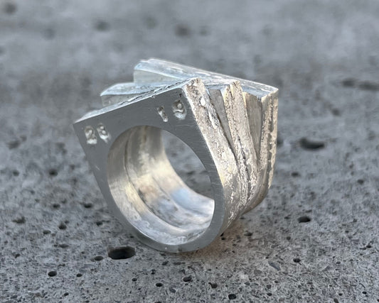 Solid silver ring with raw brutalist texture, one-of-a-kind design