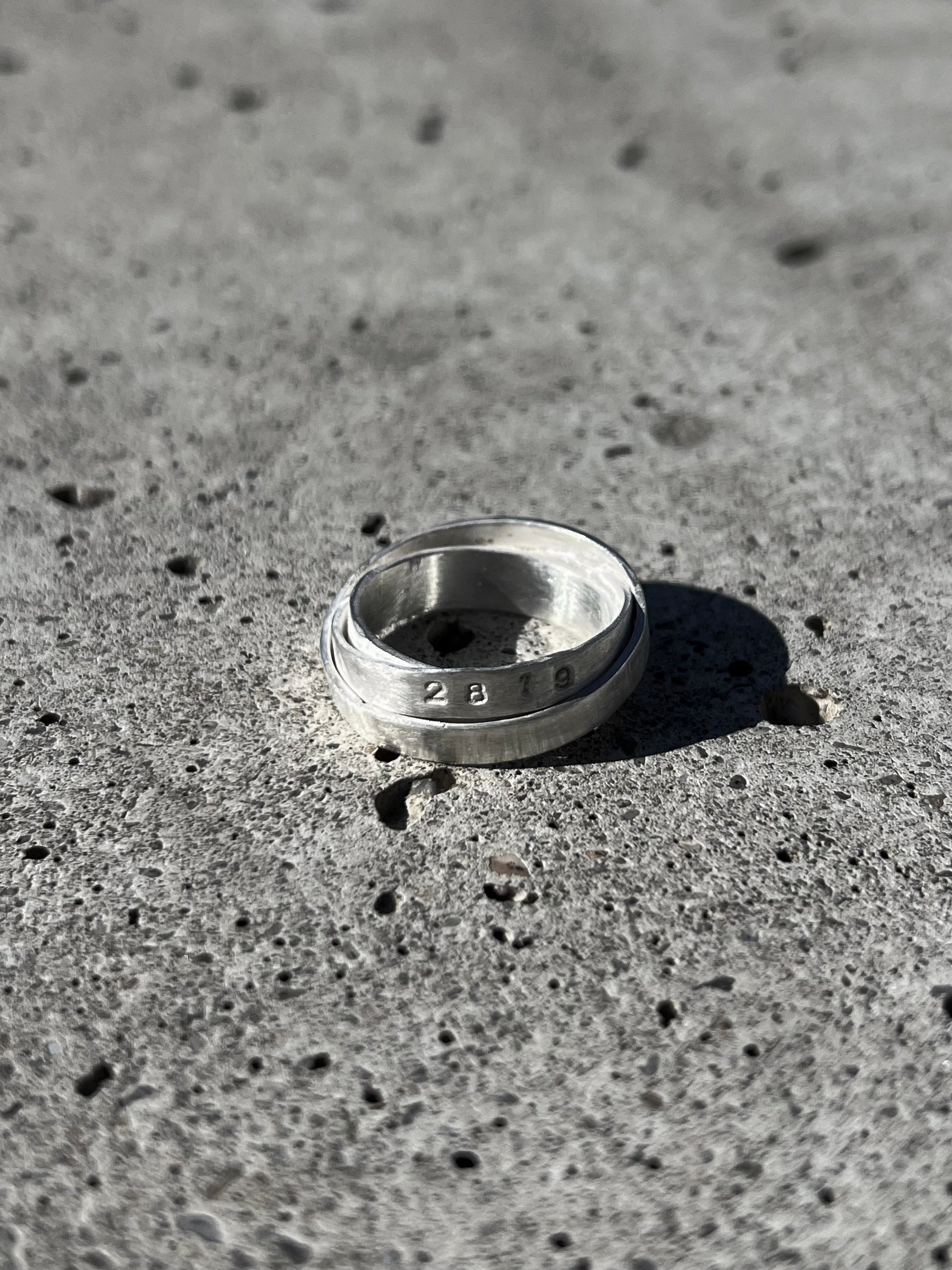 Avant-garde ring made of 925 sterling silver. Unique design, 3 rings forged together to one.