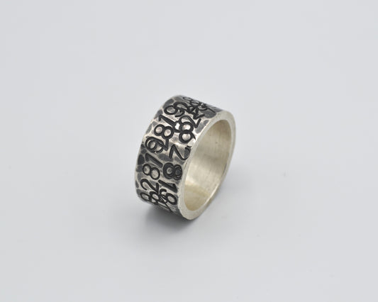 avantgarde, oxidized silver ring with numbers punched in