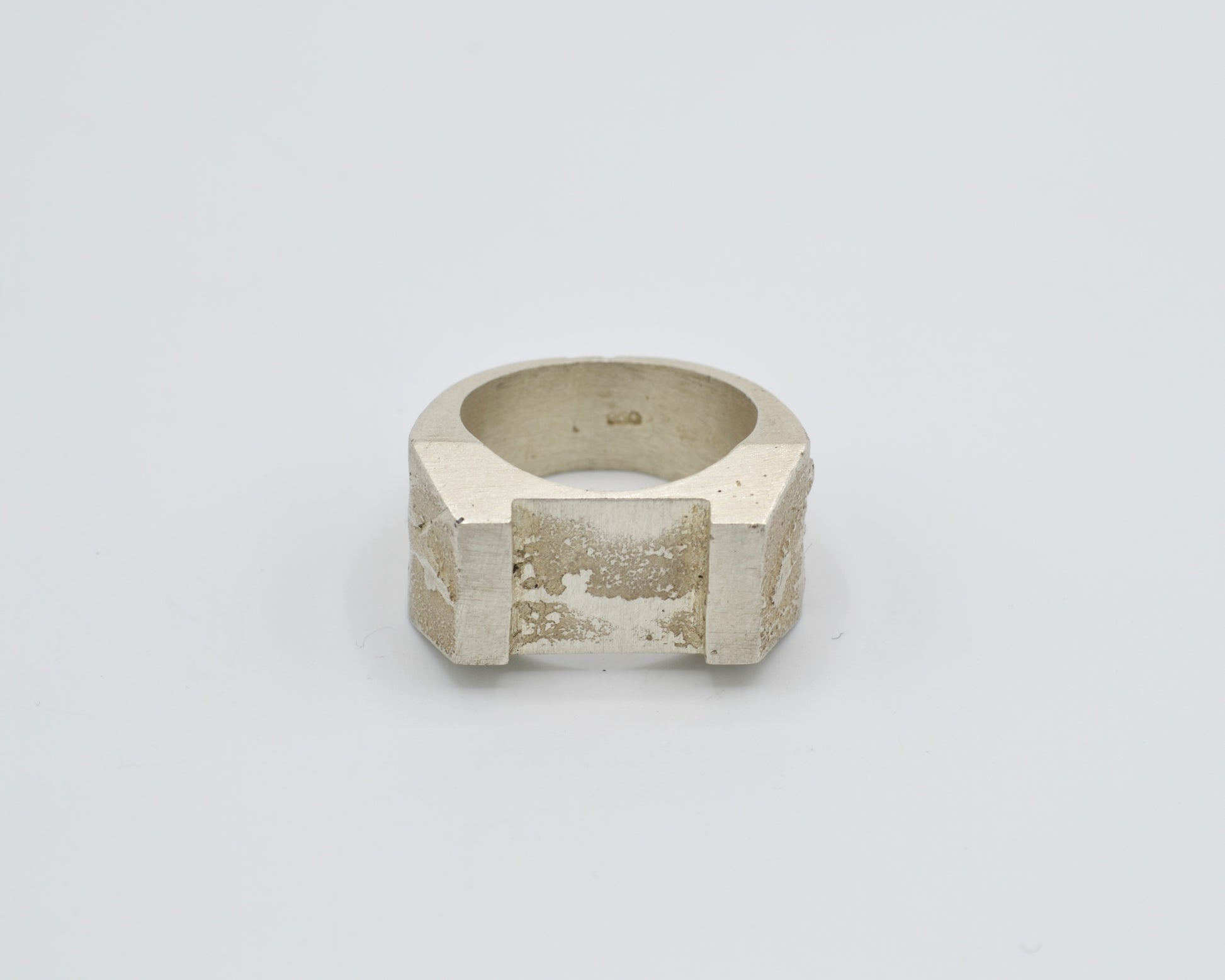 Sand cast ring with sculptural, brutalist design. Raw surface