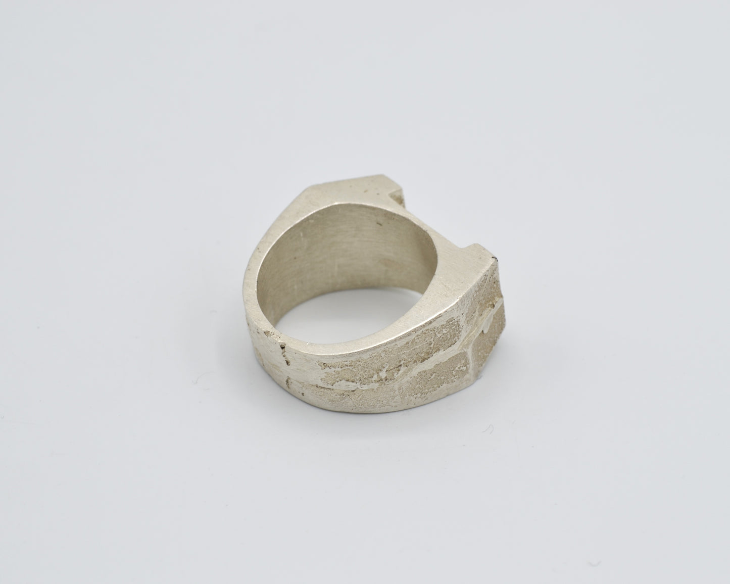 Sand cast ring with sculptural, brutalist design. Raw surface