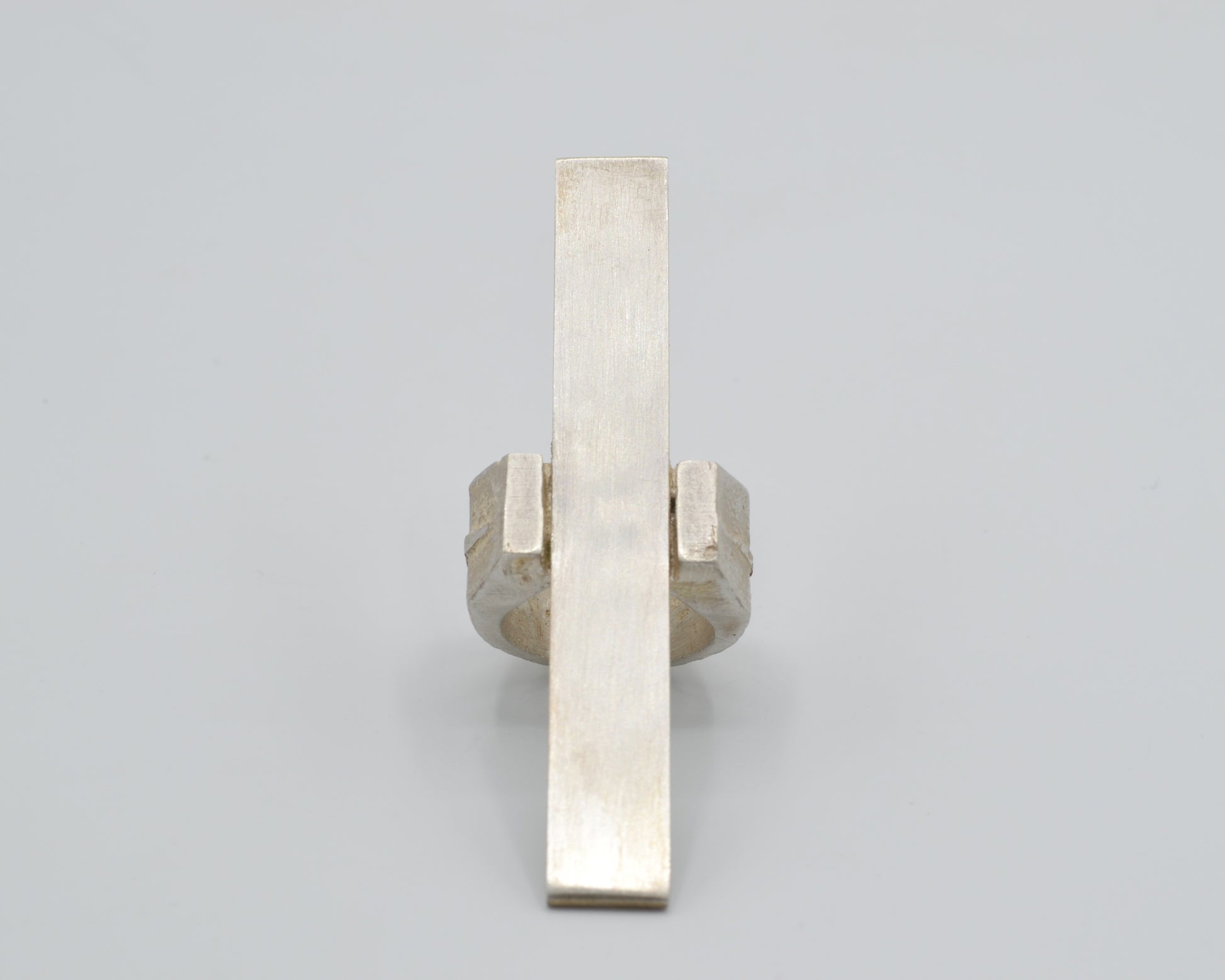 Avant-garde statement ring that reaches vertically over the finger, handcrafted from solid silver