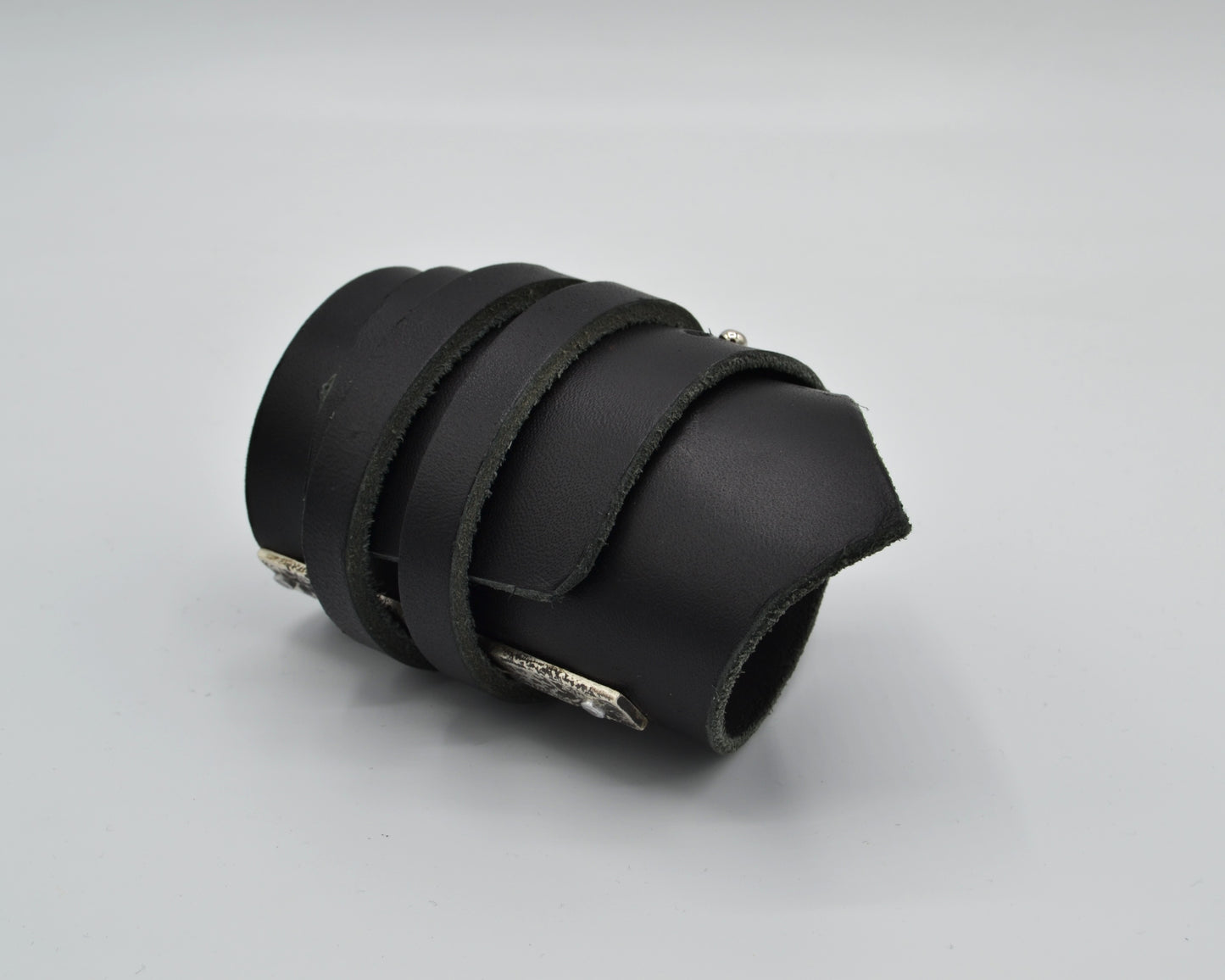 avantgarde, dark aesthetic leather bracelet with signature sterling silver plate mounted at the side.