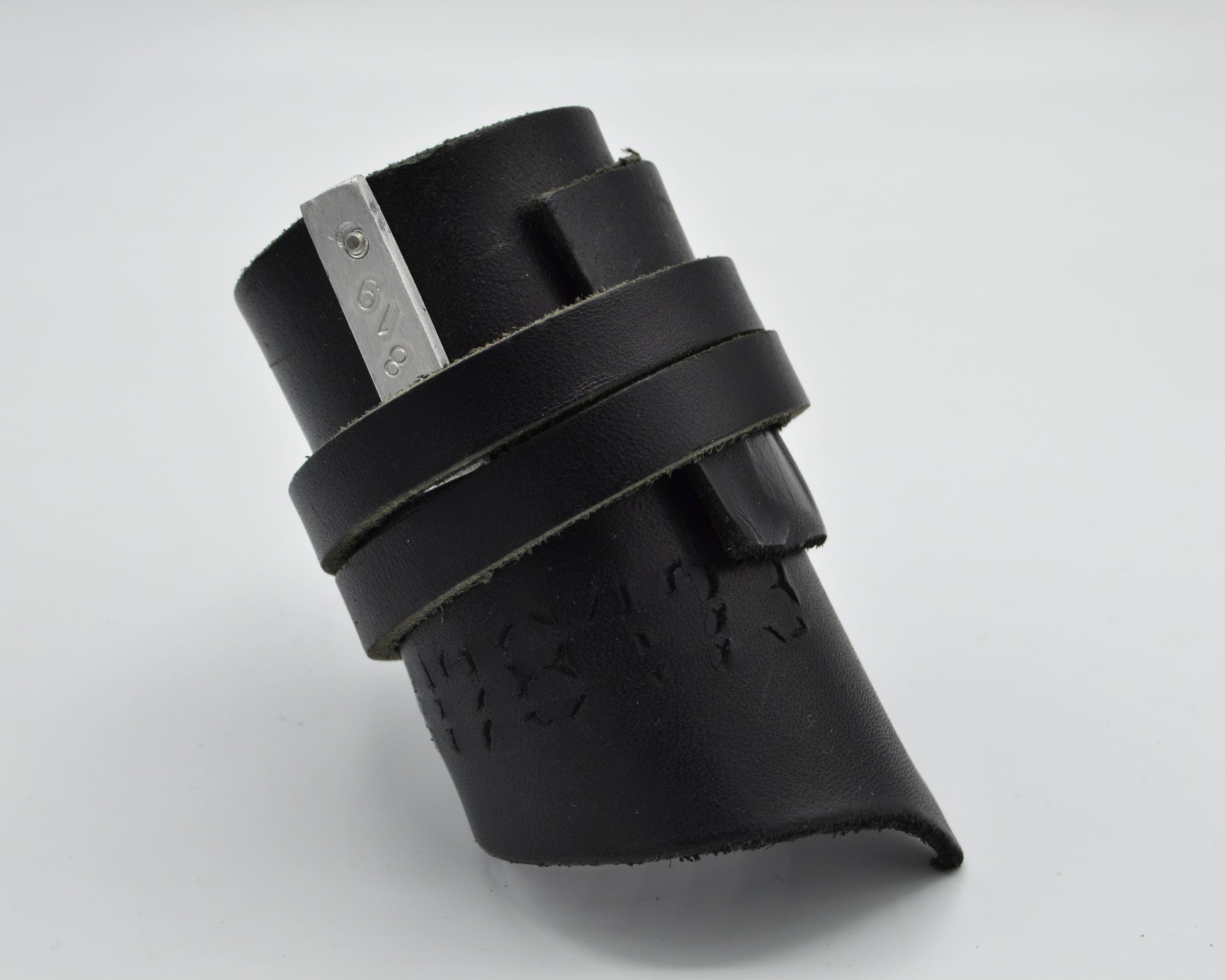 avantgarde, dark aesthetic leather bracelet with small aluminum plate mounted at the side.