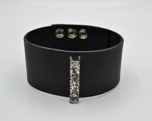 avant-garde leather choker with sterling silver plate mountred on top.