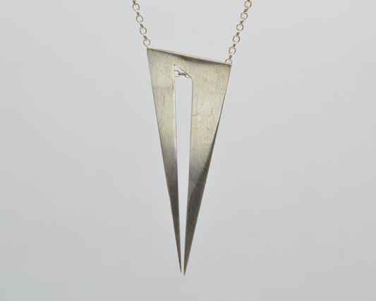 Bold pendant in 950 silver, handmade and architectural in feel with a dark, mysterious aesthetic.